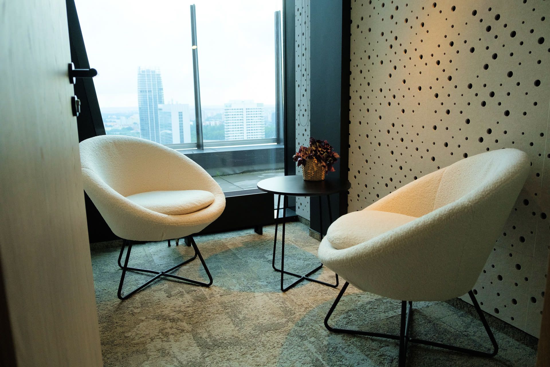 Chat room with armchairs and a view