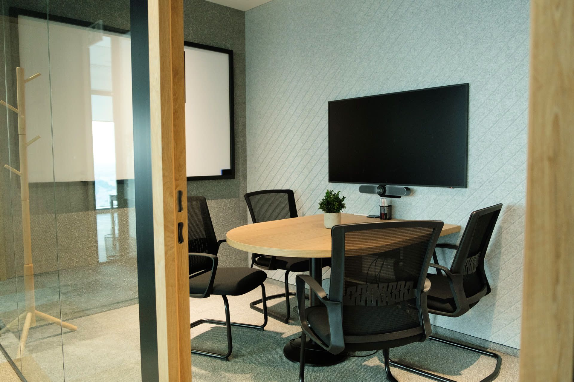 Huddle meeting room with video-conferencing equipment